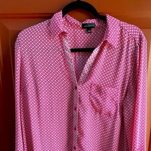 Pink button down blouse. Patterned detail.